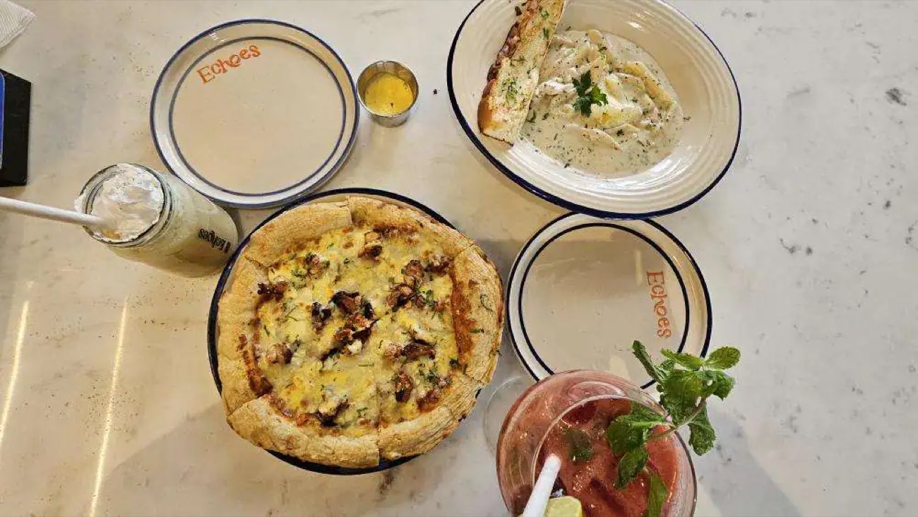 Woodfired pizza, pasta and drinks on Echoes-branded enamel plates